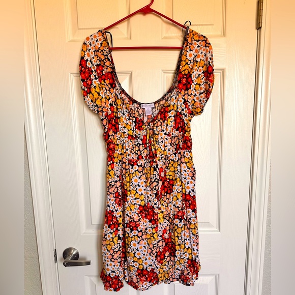 Mid length dress with a red, oranges, yellow and black. Cap sleeves. - Picture 1 of 4